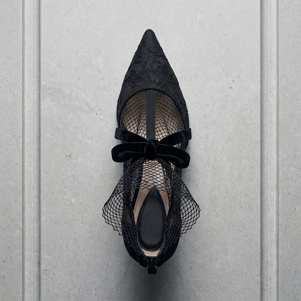 Black Lace Mesh Bow-Tie Pointed-Toe Stiletto Pumps flatlay